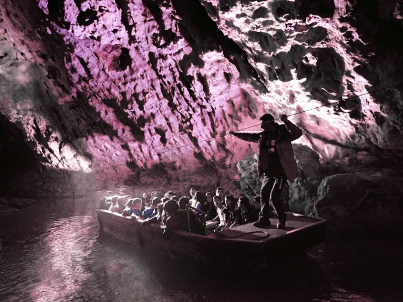 Boat crossing underground Negro river Pertosa caves